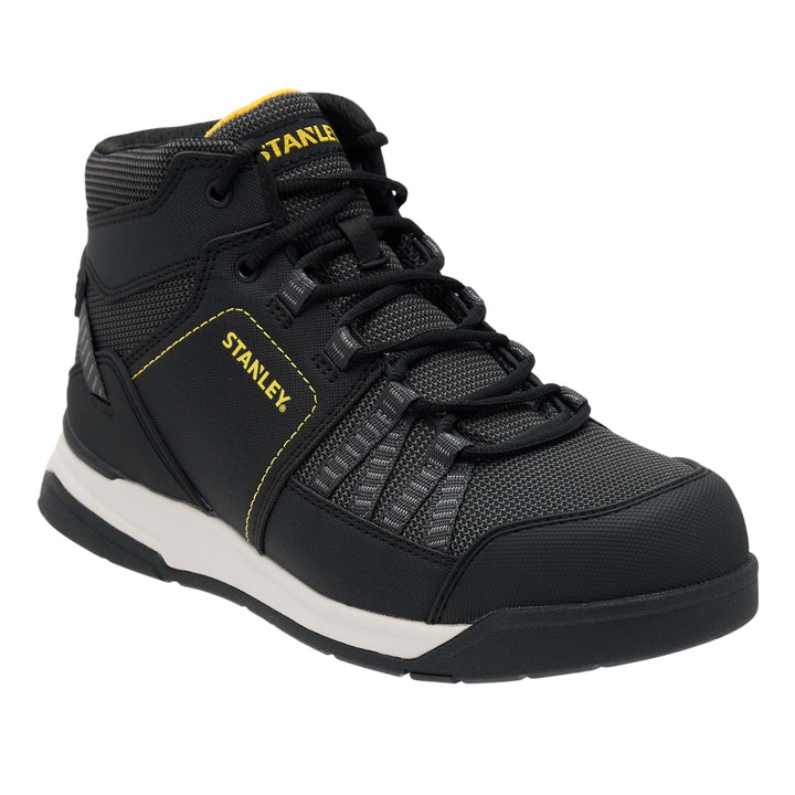 Black high-top sneaker with yellow accents on a white background