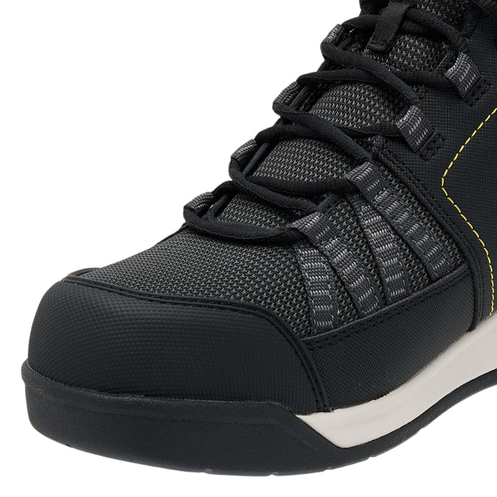 Black athletic shoe with white sole on a white background
