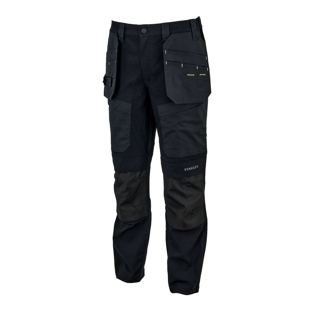 Black work pants with multiple utility pockets and reinforced knee panels, shown on a plain white background. The brand name 'STANLEY' is visible on the lower left leg.