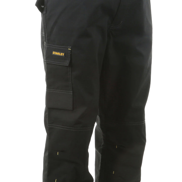 Black work pants with a Stanley logo on a white background